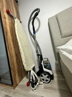 a scooter is parked next to a bed at Taksim Cihangir'de 2+1 daire in Istanbul