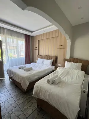 two beds in a hotel room next to each other at beyzade apart hotel in Istanbul