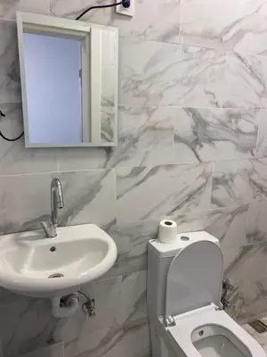 a bathroom with a sink and a toilet and a mirror at hotel yenikapı in Istanbul