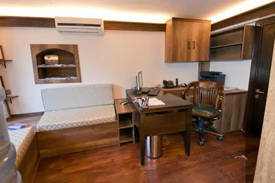 a small room with a desk and a desk at Kumluk Konak Hotel in Istanbul