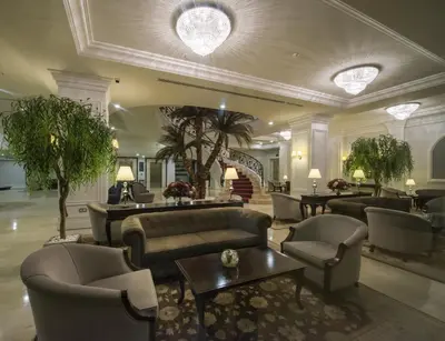 a lobby with couches and chairs and a table at Vialand Palace Hotel in Istanbul