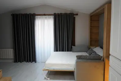 a bedroom with a bed and a large window at Adgsuites in Istanbul