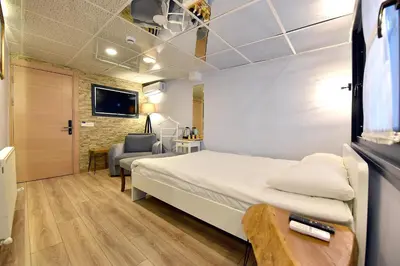 a hotel room with a bed and a chair at Sunlife Oldcity in Istanbul