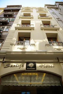 a tall white building with a sign on it at Sunlife Oldcity in Istanbul