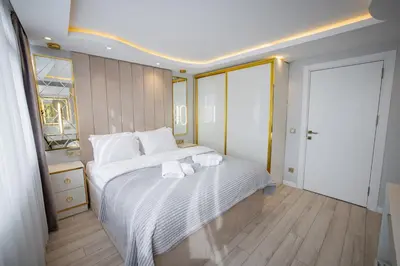 a bedroom with a large bed with towels on it at ISTANBUL SUITE in Istanbul