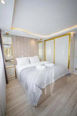 a bedroom with a large white bed in a room at ISTANBUL SUITE in Istanbul
