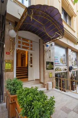 a large blue umbrella in front of a store at Istanbul Old City Beyazid Belmond Hotel in Istanbul