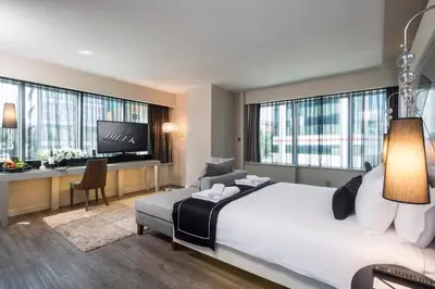 a hotel room with a bed and a desk at Bilek Hotel Kavacık in Istanbul