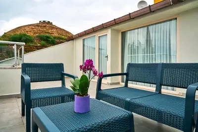 a purple vase sitting on a table on a balcony at Joyway Hotels Istanbul Sultanahmet in Istanbul