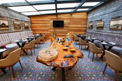 a dining room with a wooden table and chairs at Hotel Miniature Istanbul in Istanbul