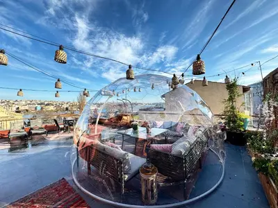 a glass dome sitting on top of a patio at Waterfront Villa by the Tram - Private Terrace with Dome & Golden Horn View in Fatih in Istanbul
