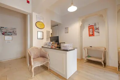 a room with a desk and a chair and a clock at Sisli MLS Hotel in Istanbul