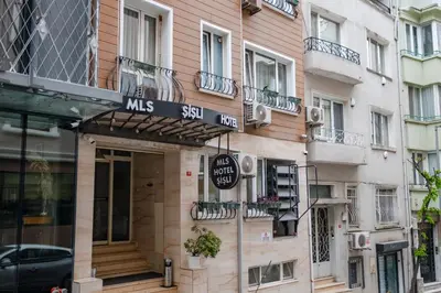 a building with a sign on the side of it at Sisli MLS Hotel in Istanbul