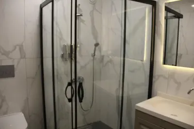 a bathroom with a shower and a sink at Eyüp Sultan Palace Hotel in Istanbul