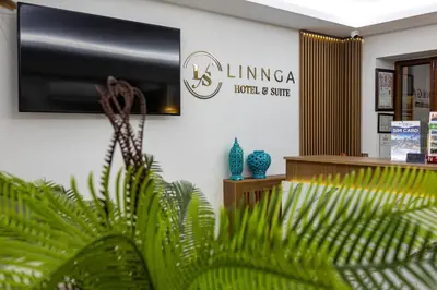 a lobby of a living area with a tv and plants at LINNGA HOTEL & SUITE in Istanbul