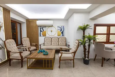 a living room with chairs and a table at LINNGA HOTEL & SUITE in Istanbul