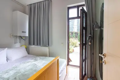 a bedroom with a bed and a window at Bright Loft with 3 bedrooms and terrace in Galata in Istanbul