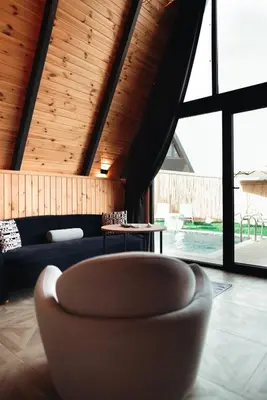 a living room with a couch and a chair at MY RESORT PRİVE in Sapanca