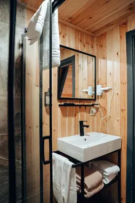 a bathroom with a sink and a glass shower at MY RESORT PRİVE in Sapanca