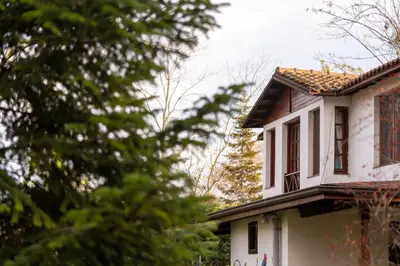 a white house with a brown roof at Beta Home Sapanca in Sapanca