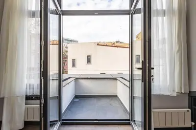 a glass door in a room with a balcony at Duplex Penthouse wparking 3BD2Bath Views! #340 in Istanbul