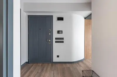 a hallway with a gray door in a building at Cozy Bright wParking 2BD1Bath Central Home!#338 in Istanbul