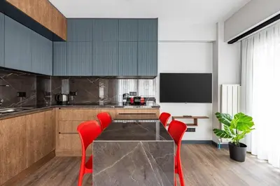 a kitchen with a glass table and red chairs at Cozy Bright wParking 2BD1Bath Central Home!#338 in Istanbul