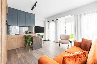 a living room with an orange couch and a kitchen at Charming Bright New 2BD1Bath Home wparking!#339 in Istanbul