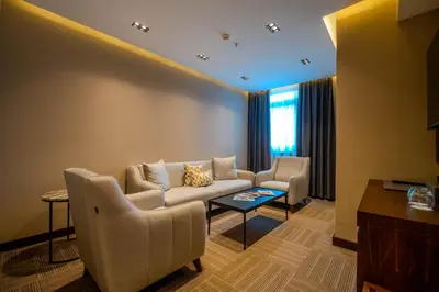a living room with a couch and chairs and a table at B'İSTANBUL HOTEL in Istanbul