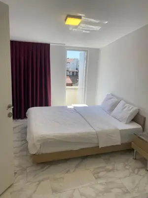 a bedroom with a large bed with a window at hotel YENİkapı in Istanbul