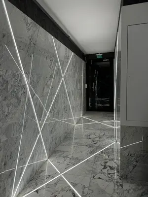 a lobby with a marble wall and a door at The Business Class Suit Karakoy in Istanbul