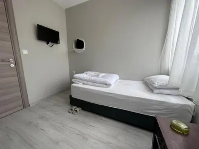 a small bedroom with a bed and a window at HOTEL KOCABASOGLU in Istanbul