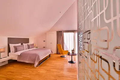 a bedroom with a bed and a chair in it at Business Life Hotel & Spa Şişli in Istanbul