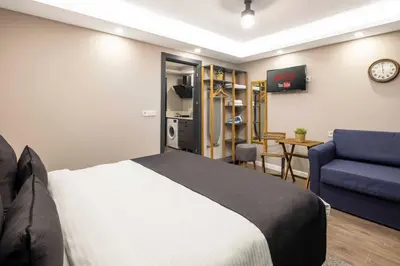 a hotel room with a bed and a couch at APARTMENTS BAKRAC 26 in Istanbul