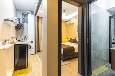 a small room with a bed and a bathroom at APARTMENTS BAKRAC 26 in Istanbul