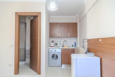 a kitchen with a washing machine and a washer at City Hall Apart Hotel Sultanahmet in Istanbul