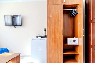 a small kitchen with a refrigerator and a microwave at City Hall Apart Hotel Sultanahmet in Istanbul