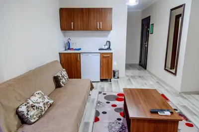 a living room with a couch and a table at City Hall Apart Hotel Sultanahmet in Istanbul