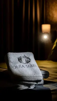 a towel sitting on top of a bed at Olea Suites Otel in Gemlik