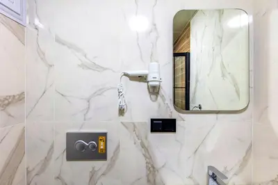 a bathroom with a mirror and a camera at The Business Class Hotel in Istanbul