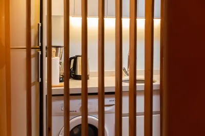 a bars in a room with a sink and a table at G&B MANSION in Istanbul