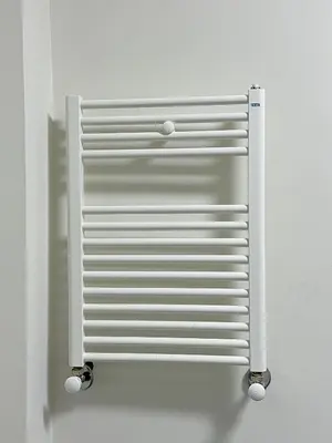 a white metal object hanging on a wall at Taksim Millennium Alkan Residence in Istanbul