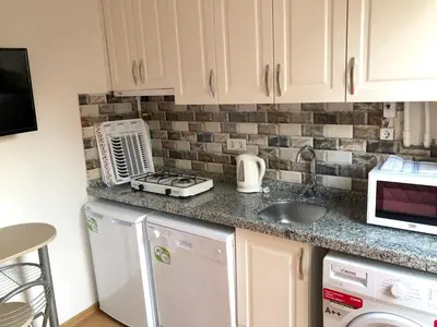 a kitchen with a sink and a counter top at Istanberry - Dream Apartments in Istanbul