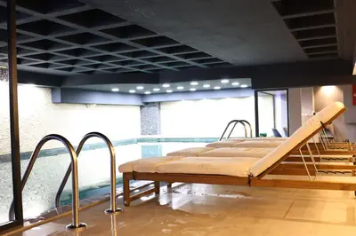 a bed in a room with a large window at Cip Hotel & Spa - İstanbul Bakırköy City Center in Istanbul
