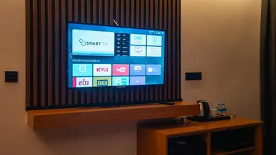 a flat screen tv sitting on top of a table at Cip Hotel & Spa - İstanbul Bakırköy City Center in Istanbul