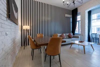 a living room with a table and chairs and a couch at 5 Apartment Galata in Istanbul
