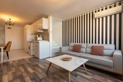 a living room with a couch and a table at 5 Apartment Galata in Istanbul