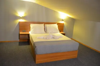 a bedroom with a bed with a ribbon on it at Rosse Hotel in Esenyurt