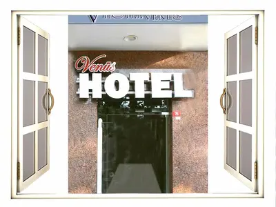 a view of a hotel sign through a window at Venus Hotel Taksim in Istanbul
