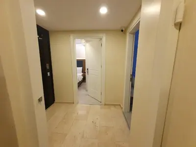 an empty hallway with a hallway leading to a bedroom at Hotel Esve Istanbul in Istanbul